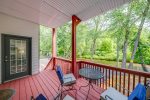 Porch with table & chairs & river view